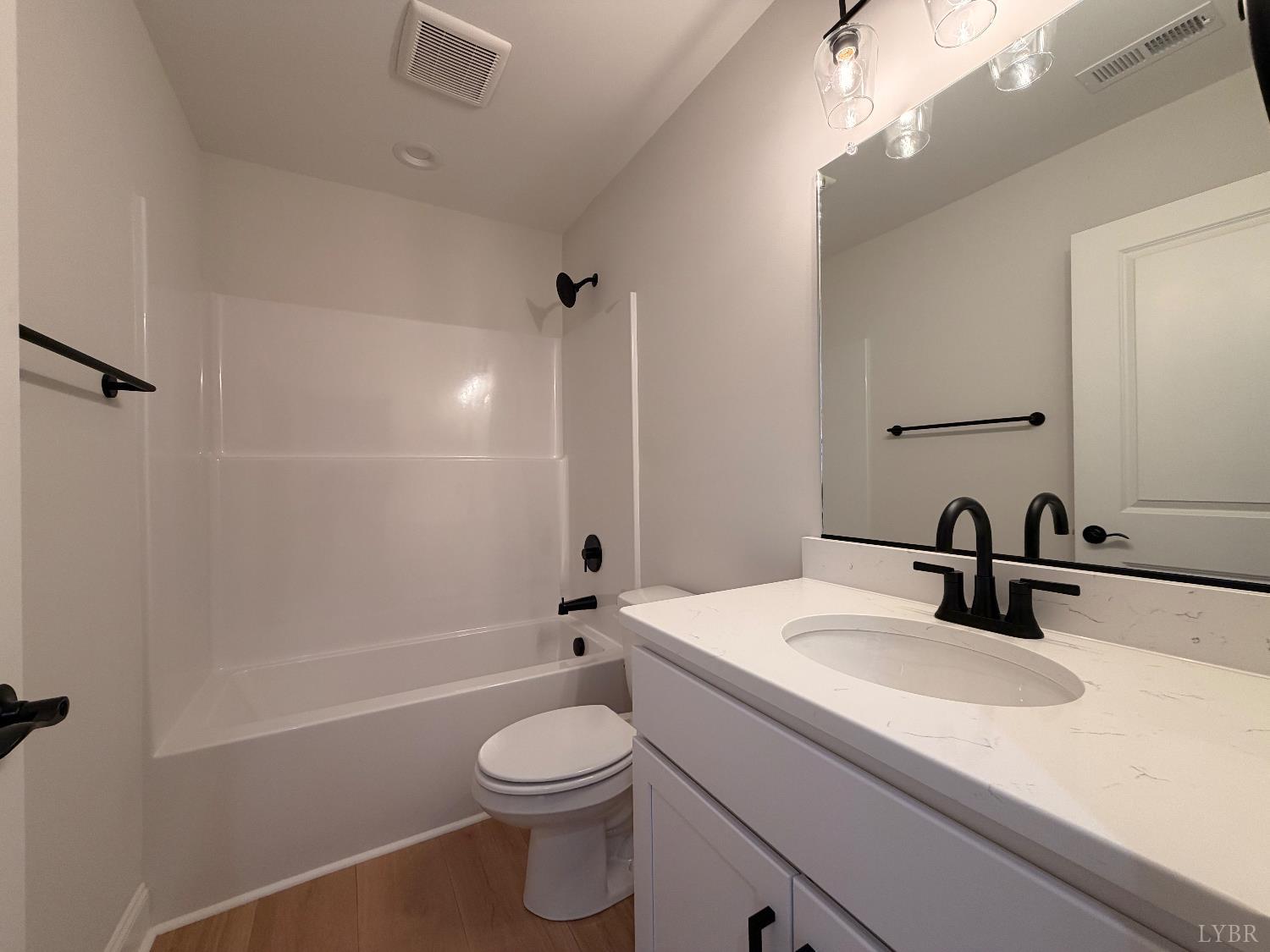 536 Leesville Road, Unit 207 Lynchburg, VA 24502 - Photo 27 of 35 a bathroom with a sink a toilet and shower