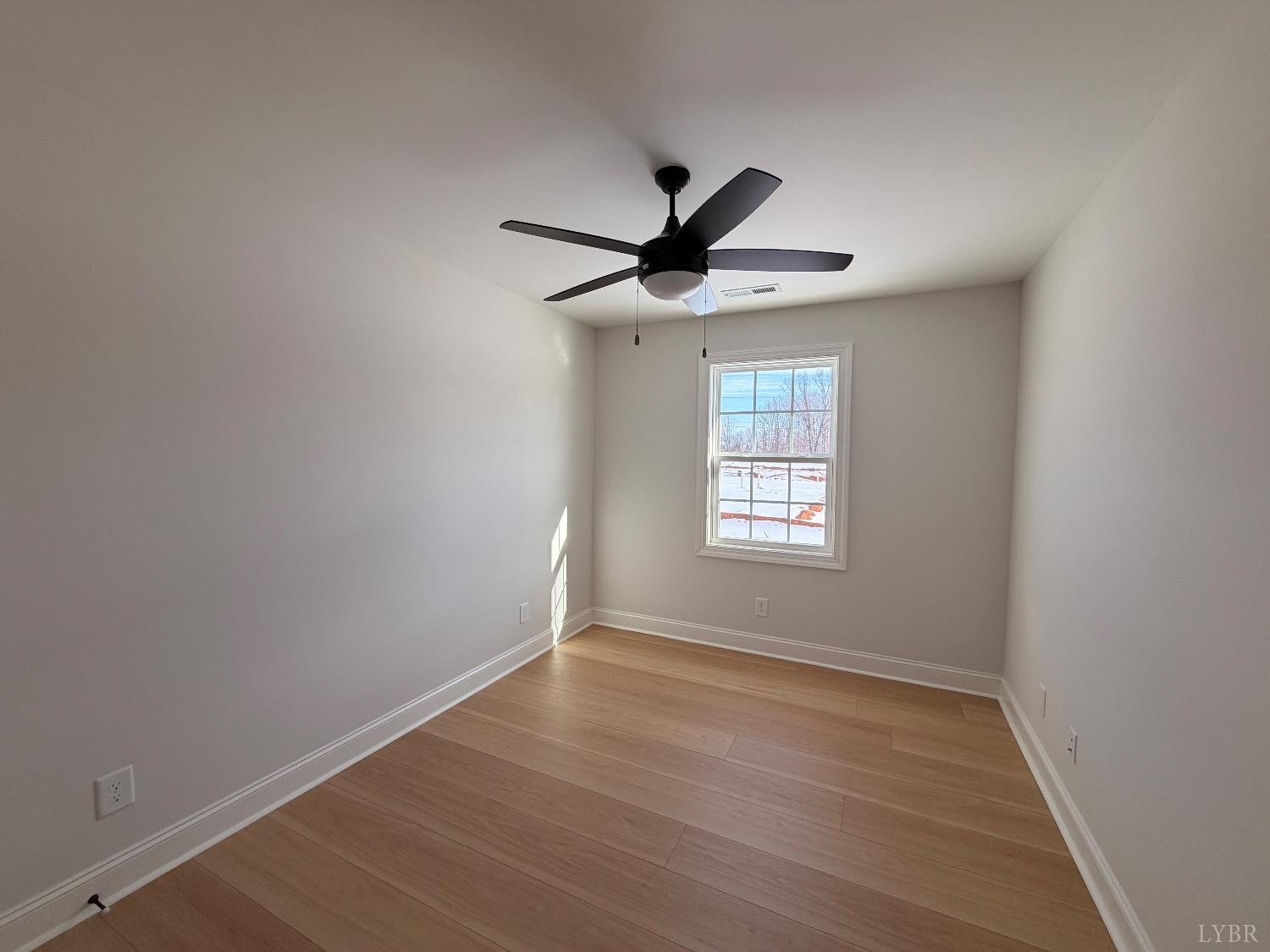 536 Leesville Road, Unit 207 Lynchburg, VA 24502 - Photo 29 of 35 an empty room with wooden floor and windows