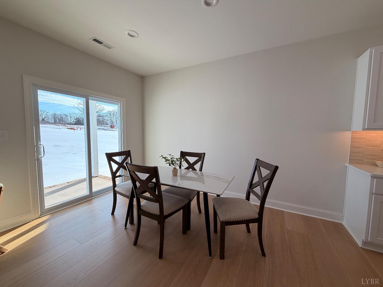 536 Leesville Road, Unit 207 Lynchburg, VA 24502 - Photo 32 of 35 a view of a dining room with furniture and wooden floor