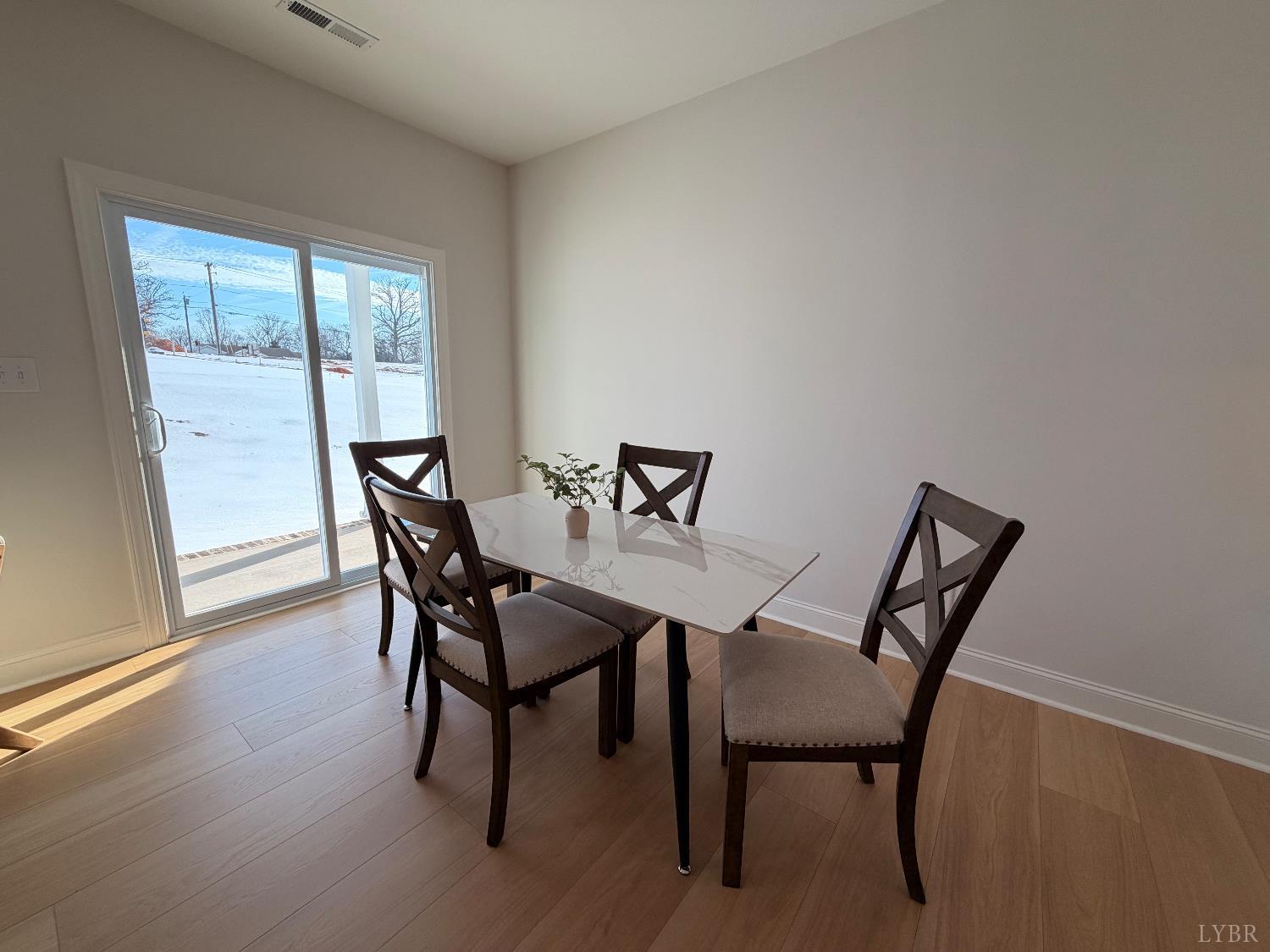 536 Leesville Road, Unit 207 Lynchburg, VA 24502 - Photo 33 of 35 a view of a dining room with furniture and wooden floor
