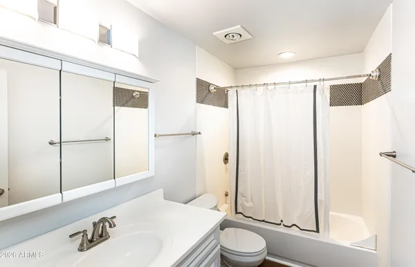 a bedroom with bed and flat screen tv