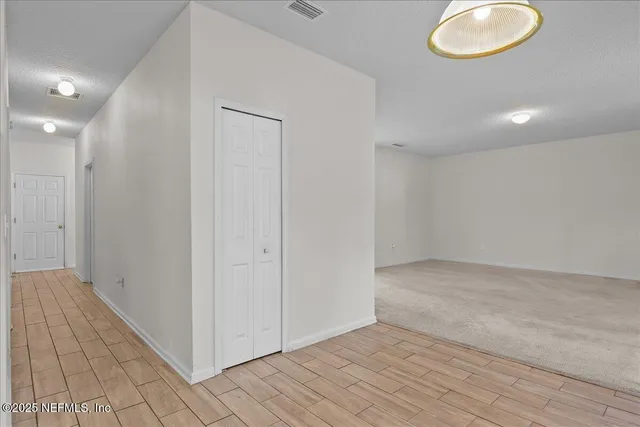 an empty room and wooden floor