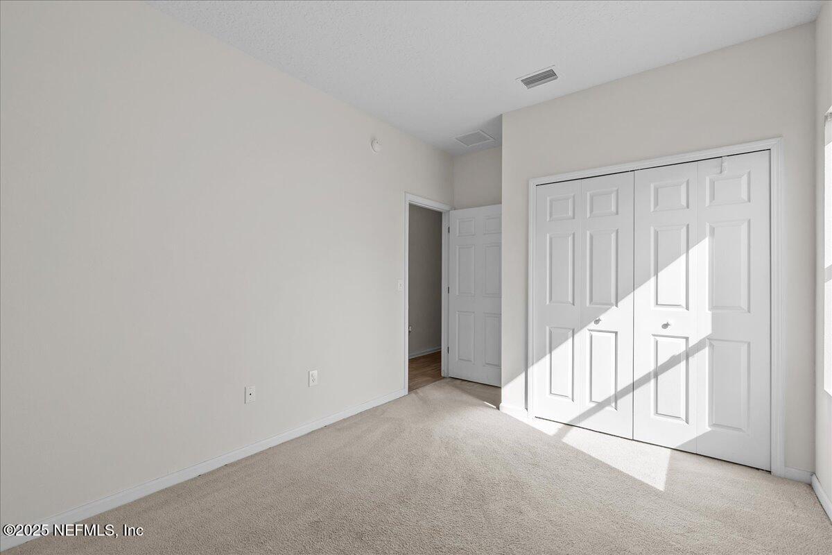 3131 Garden Brook Road Jacksonville, FL 32208 - Photo 12 of 31 a view of an empty room with stairs