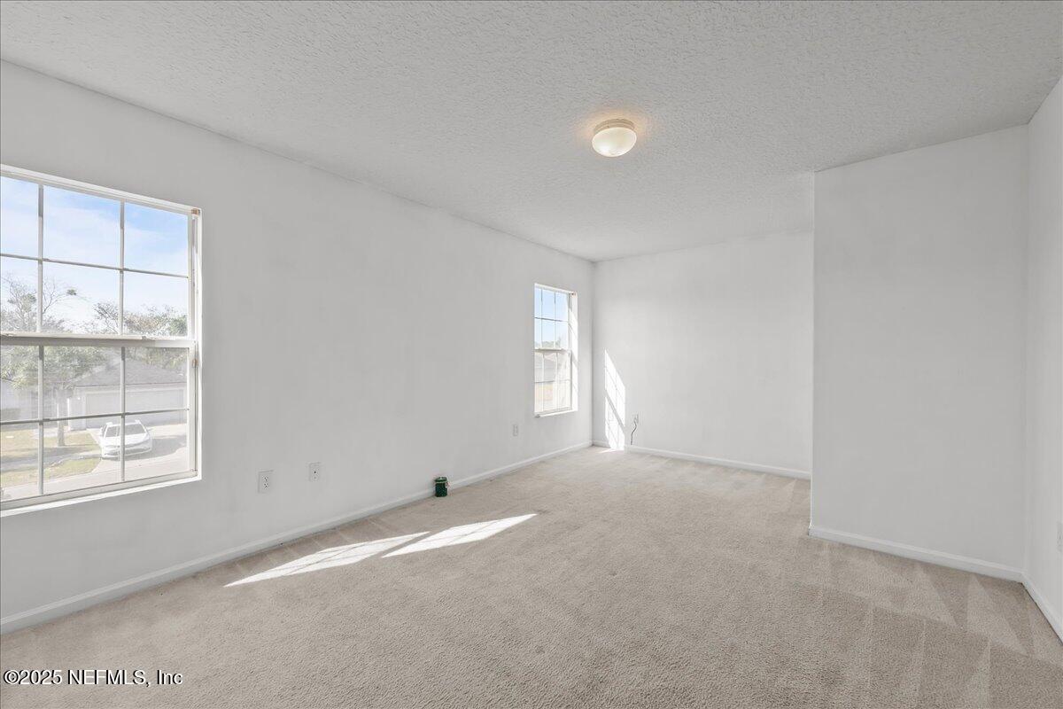 3131 Garden Brook Road Jacksonville, FL 32208 - Photo 15 of 31 en empty room with windows