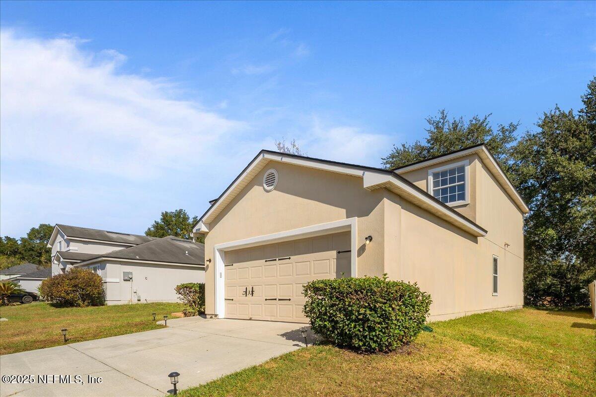 3131 Garden Brook Road Jacksonville, FL 32208 - Photo 2 of 31 a view of house with yard