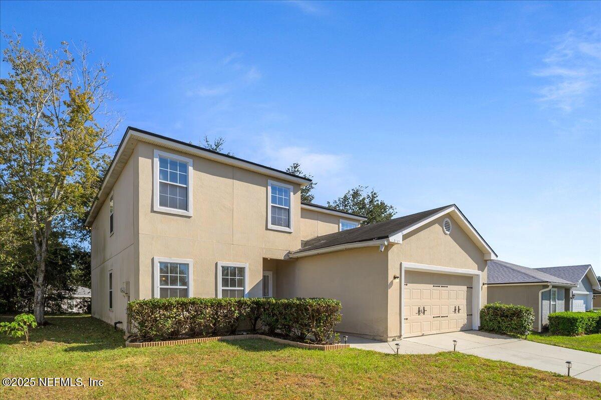 3131 Garden Brook Road Jacksonville, FL 32208 - Photo 3 of 31 a front view of a house with a yard