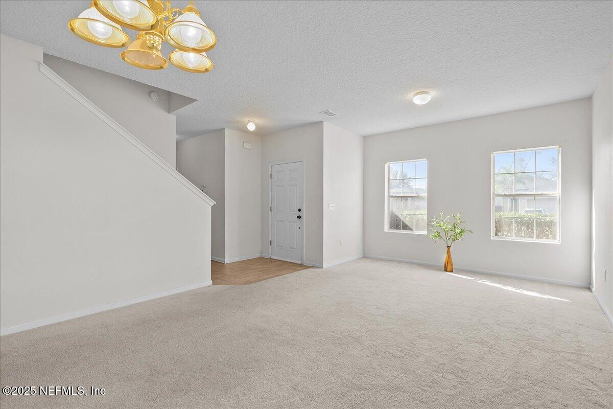 3131 Garden Brook Road Jacksonville, FL 32208 - Photo 5 of 31 a view of an empty room with a window