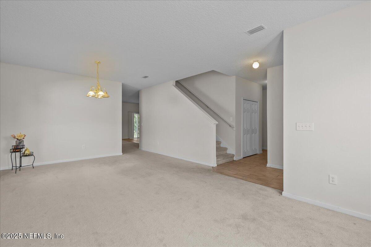 3131 Garden Brook Road Jacksonville, FL 32208 - Photo 6 of 31 a view of an empty room with a window