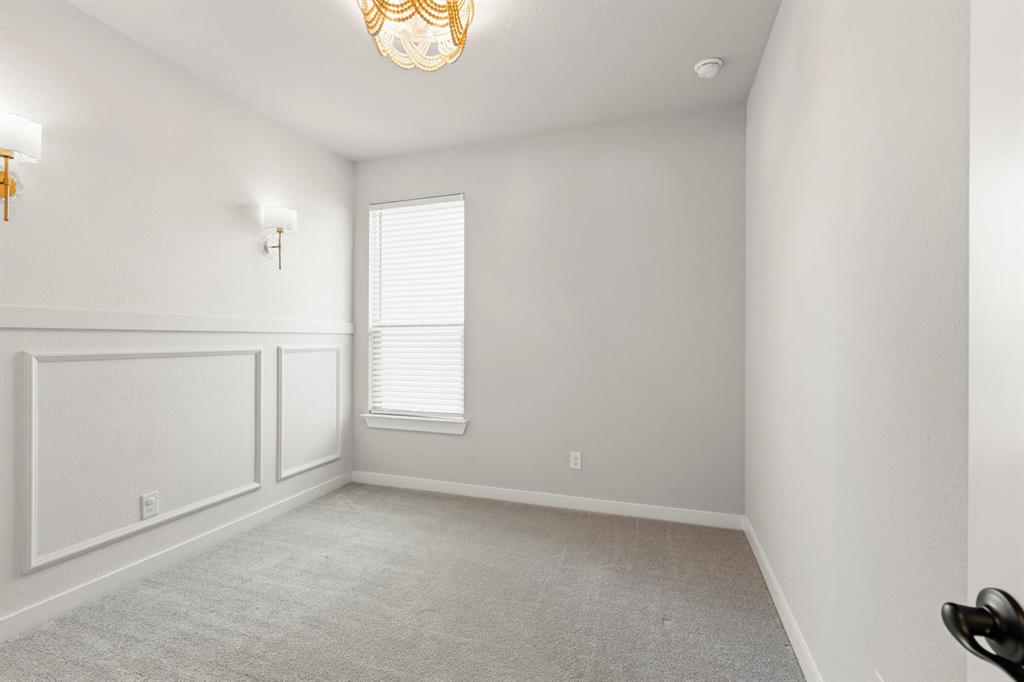 3311 Willena Road Melissa, TX 75454 - Photo 34 of 40 Room featuring wainscoting detail, neutral carpeting, and a window with blinds
