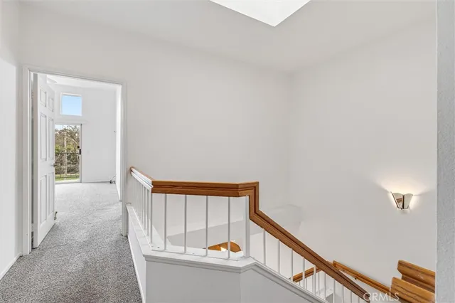 a view of an empty room with windows