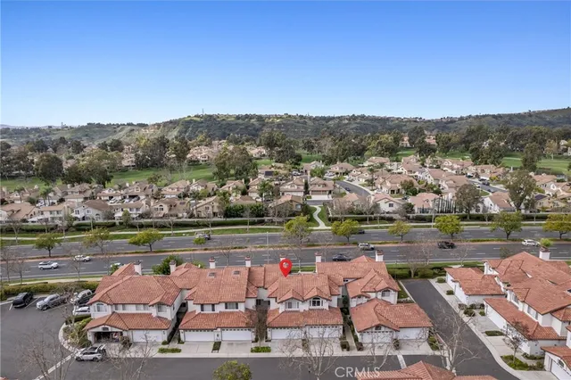 an aerial view of residential houses and outdoor space