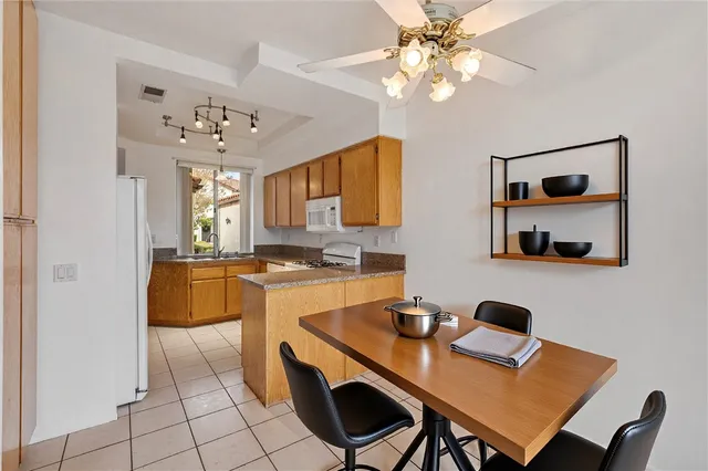 a very nice looking dining room with a table and chairs