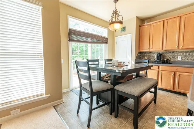a dining room with furniture and window