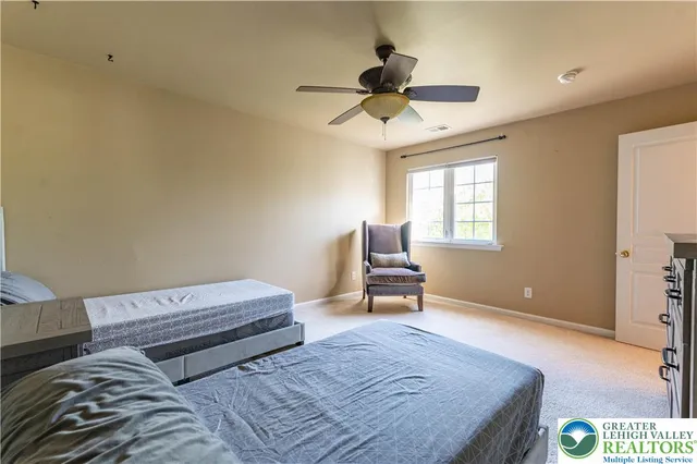 a bedroom with a bed and couch