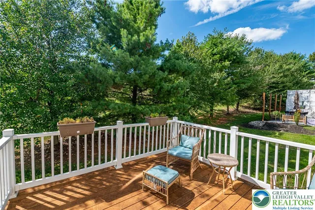 a house view with a sitting space and garden