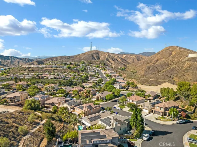 a view of a city with mountains in the background