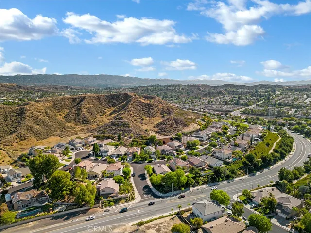 an aerial view of residential building with green space