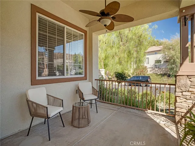 a view of a balcony with furniture