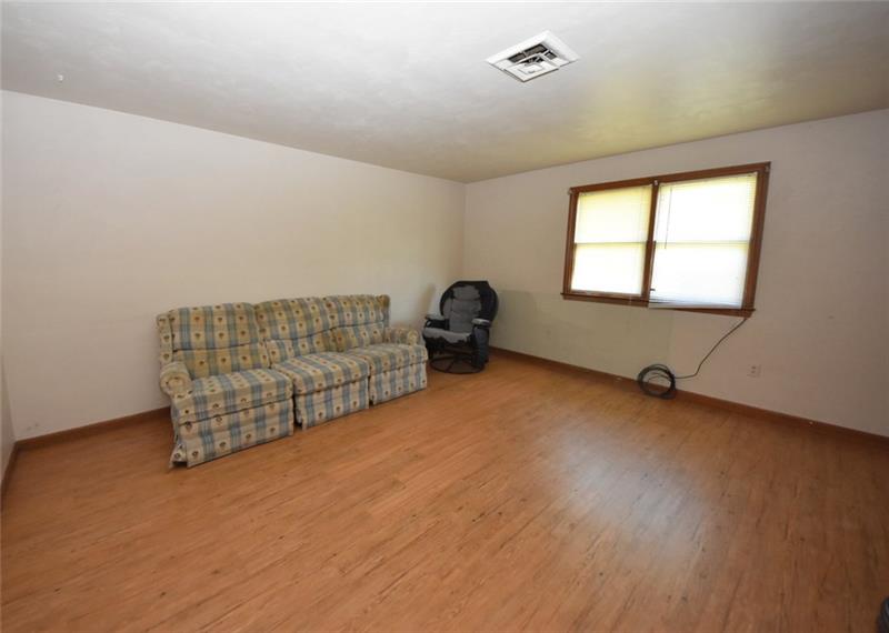 312-314 Mohawk School Road New Castle, PA 16102 - Photo 3 of 14 Living Room in Unit 312 - measures 15' x 14' - new maintenance free flooring installed this year.