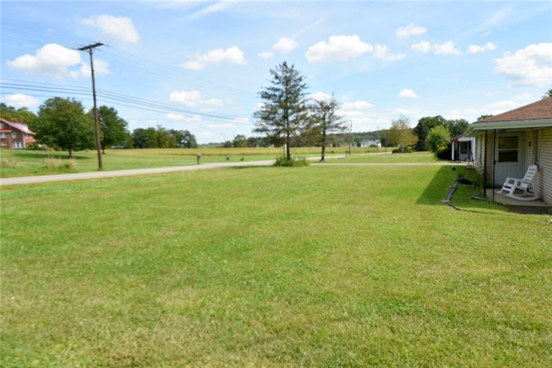 312-314 Mohawk School Road New Castle, PA 16102 - Photo 8 of 14 Lot is 0.574 acres. The lot is level and has a wrap around driveway for easy access to the main roadway.