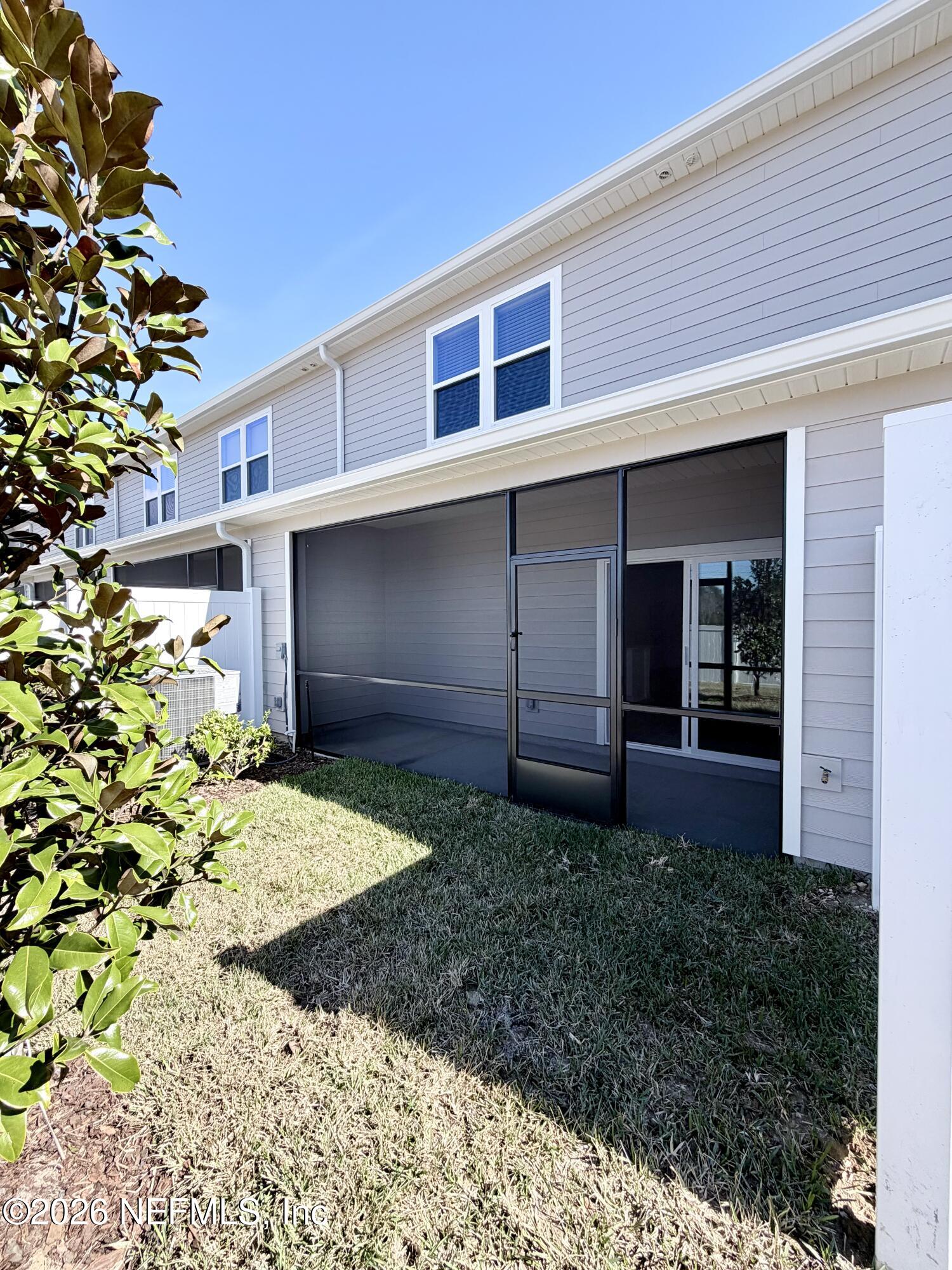 2113 Windward Cay Lane Middleburg, FL 32068 - Photo 13 of 34 a front view of a house with garden