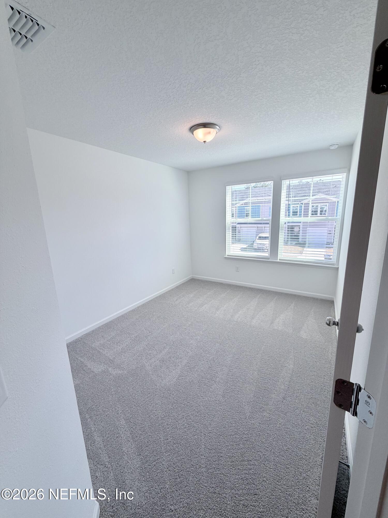 2113 Windward Cay Lane Middleburg, FL 32068 - Photo 18 of 34 an empty room with windows