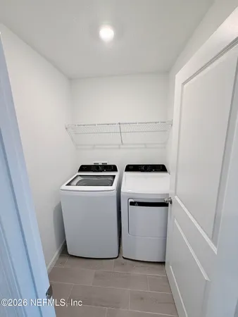 a utility room with dryer and washer