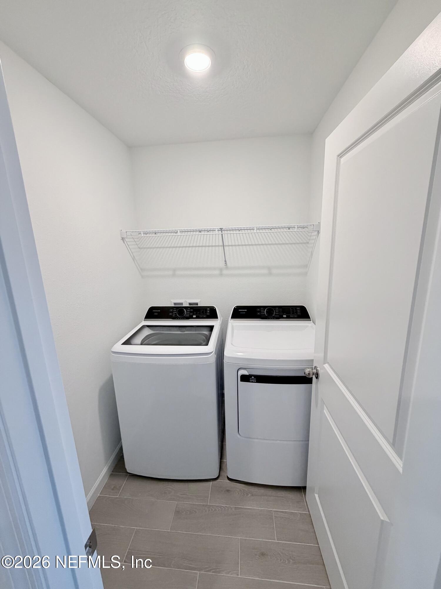 2113 Windward Cay Lane Middleburg, FL 32068 - Photo 24 of 34 a utility room with dryer and washer