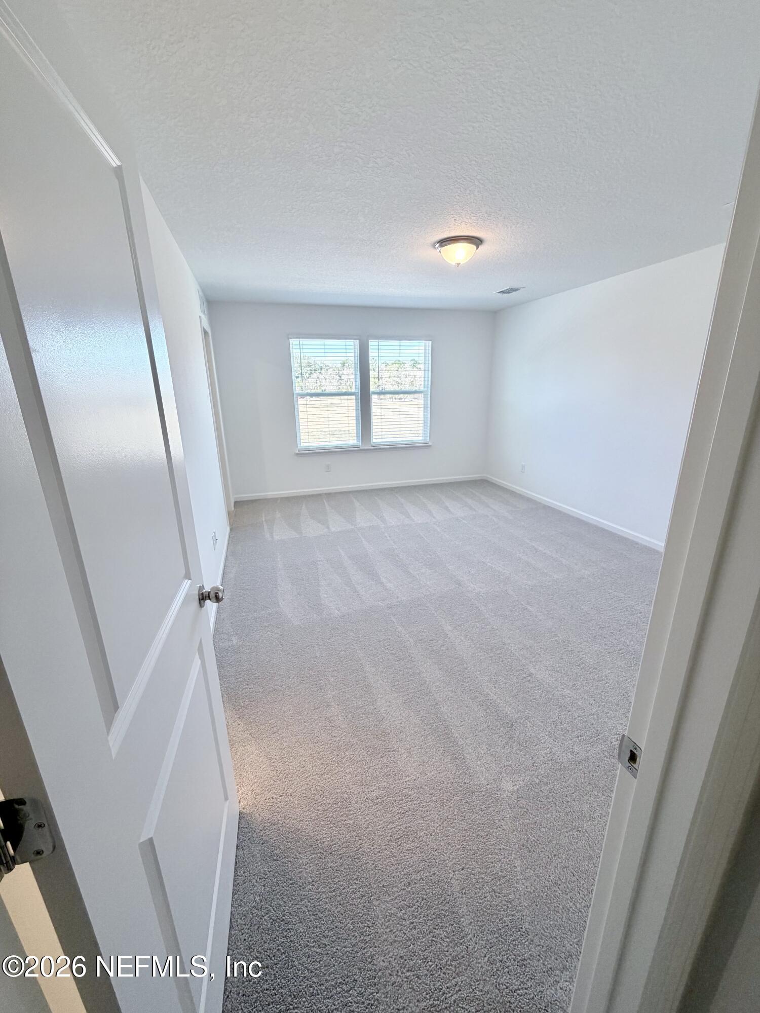 2113 Windward Cay Lane Middleburg, FL 32068 - Photo 25 of 34 a view of an empty room with a window