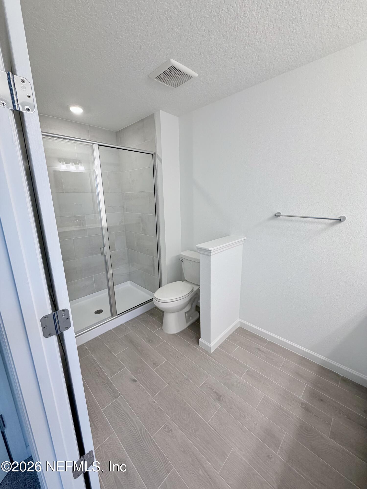 2113 Windward Cay Lane Middleburg, FL 32068 - Photo 28 of 34 a bathroom with a shower toilet and sink