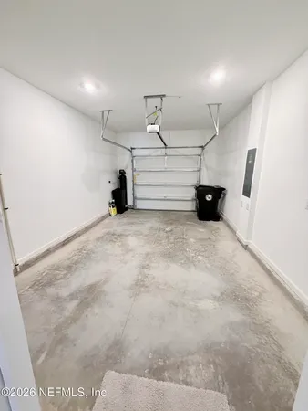 a view of an empty room with windows