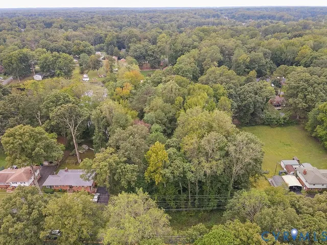 an aerial view of house with yard
