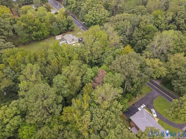 a view of a backyard with swimming pool