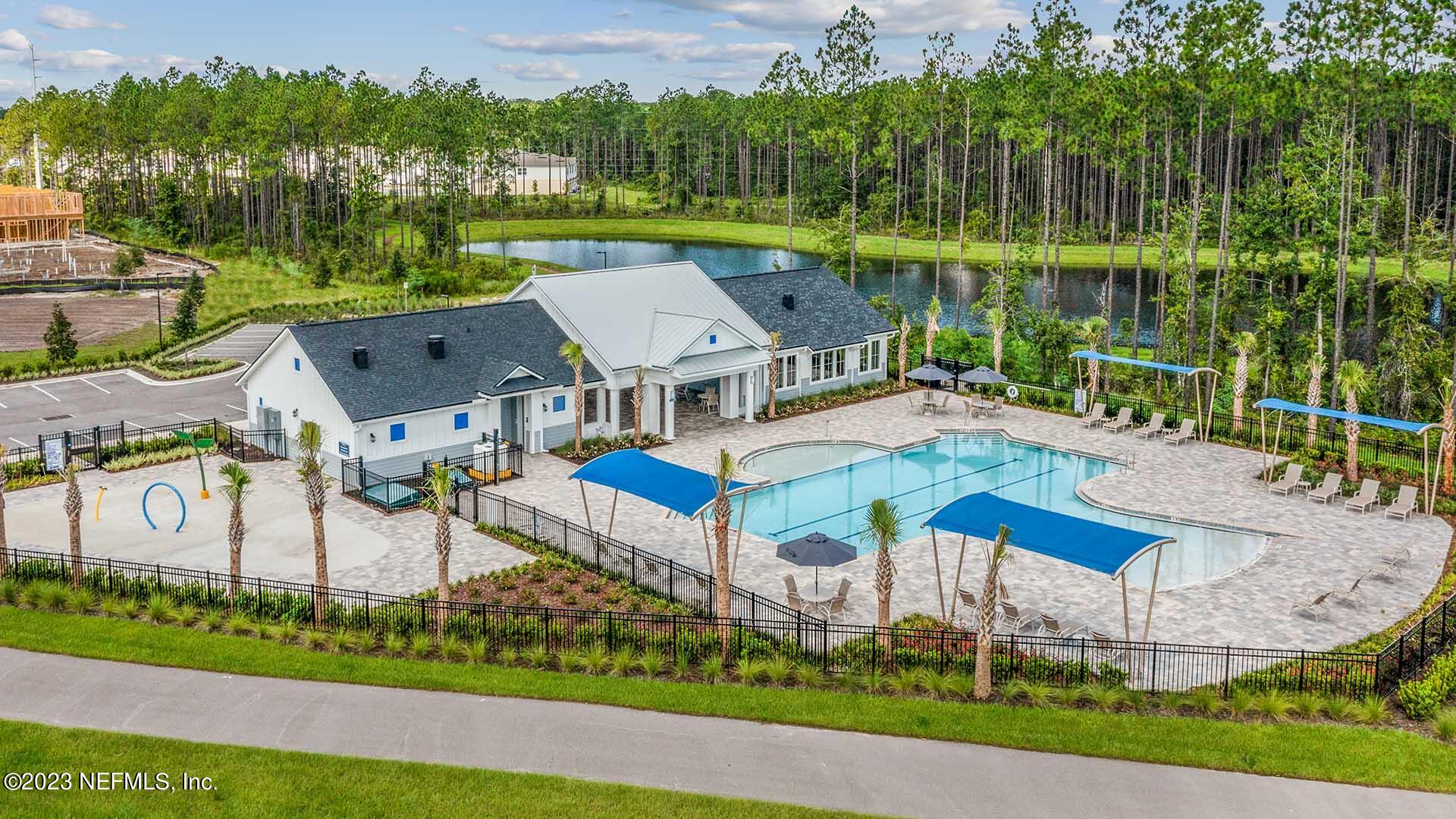 48 Barley Street St. Augustine, FL 32092 - Photo 29 of 37 an aerial view of a house with a garden and lake view