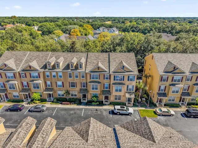 a view of building with lot of cars parked on road
