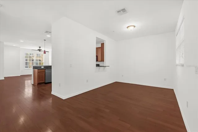 a view of a kitchen with a sink and a refrigerator
