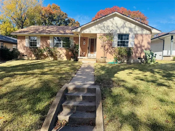 front view of a house with a yard