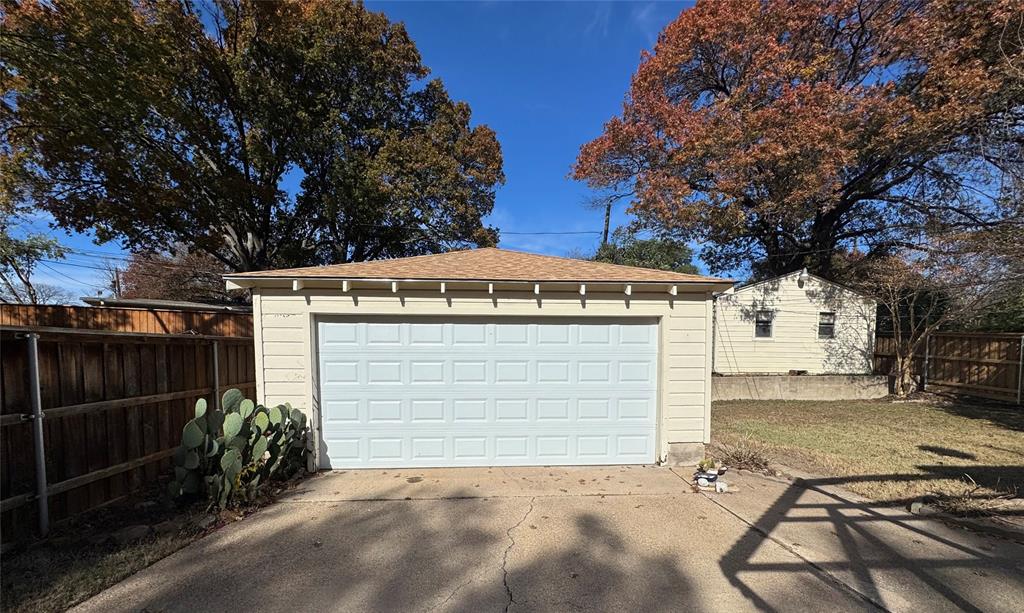 2261 Springhill Drive Dallas, TX 75228 - Photo 11 of 12 a view of a house with a garage