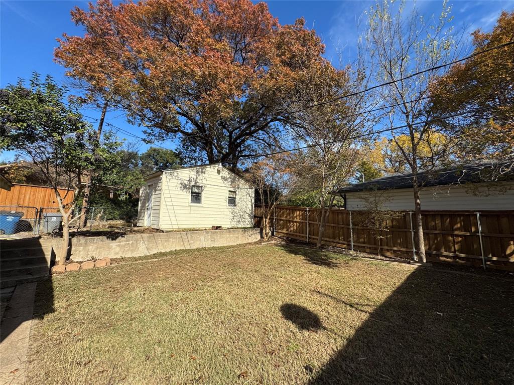 2261 Springhill Drive Dallas, TX 75228 - Photo 12 of 12 a view of a house with a snow in the yard