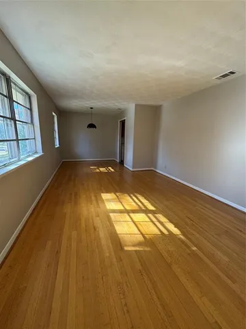 a view of empty room with windows