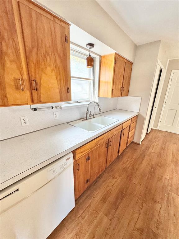 2261 Springhill Drive Dallas, TX 75228 - Photo 3 of 12 a kitchen with stainless steel appliances sink and wooden floor