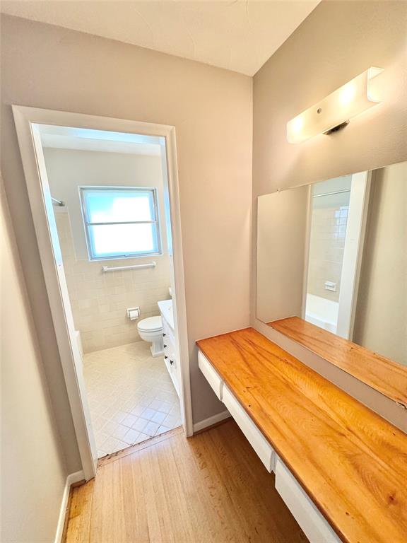 2261 Springhill Drive Dallas, TX 75228 - Photo 6 of 12 a bedroom with a bed and a mirror