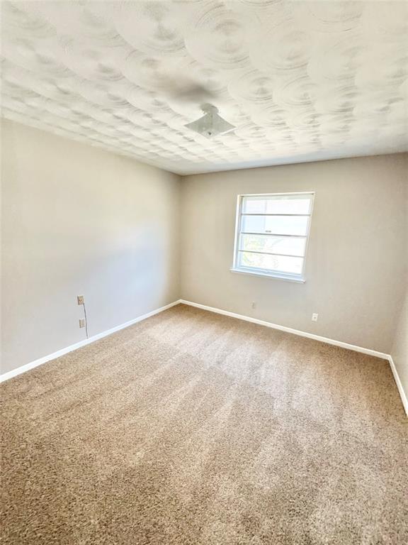 2261 Springhill Drive Dallas, TX 75228 - Photo 8 of 12 an empty room with a window