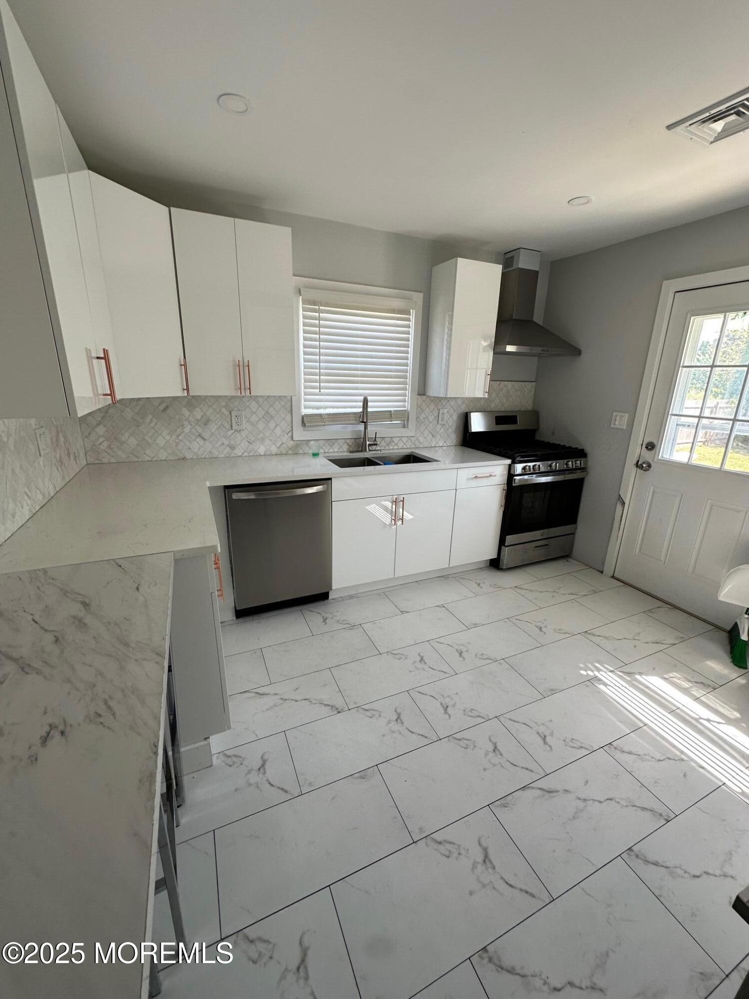10 Cambell Court, Unit W Deal, NJ 07723 - Photo 12 of 28 a kitchen with a sink cabinets and window