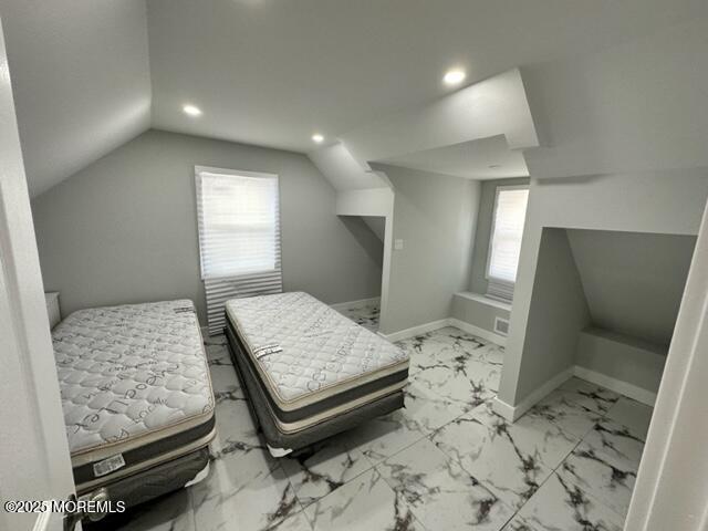 10 Cambell Court, Unit W Deal, NJ 07723 - Photo 19 of 28 a bedroom with a bed and wooden floor