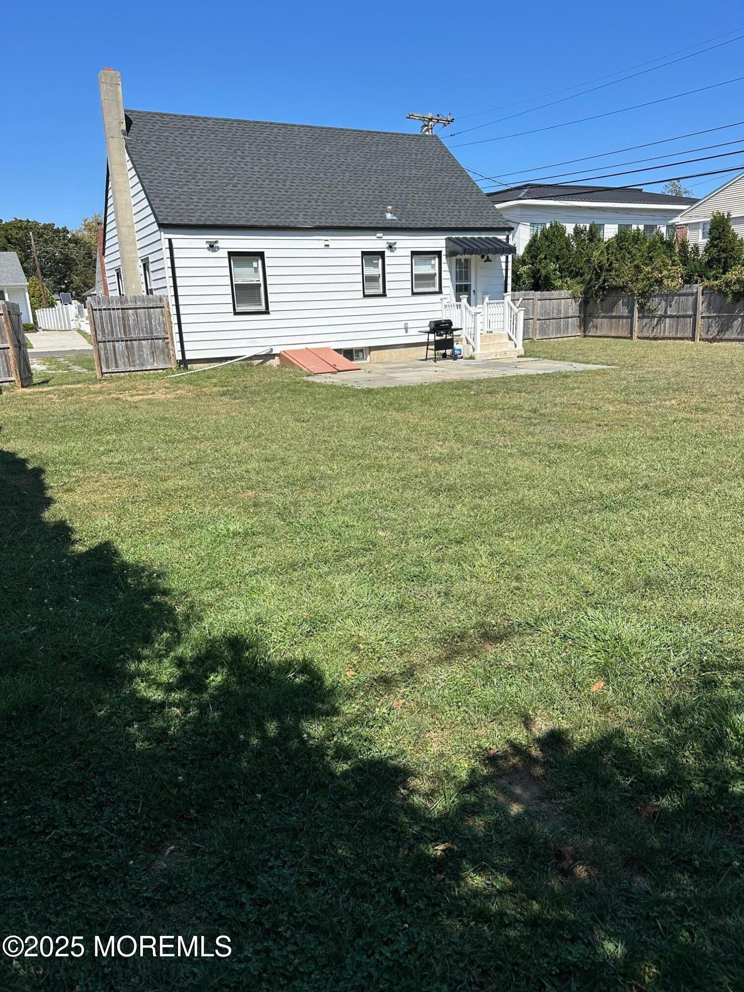 10 Cambell Court, Unit W Deal, NJ 07723 - Photo 7 of 28 a front view of a house with a yard