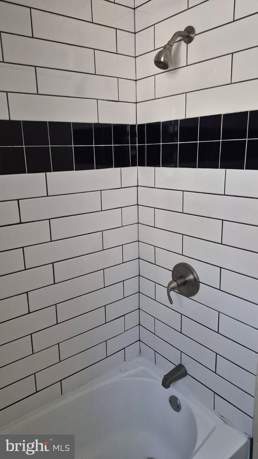 5004 Meadowbrook Drive Suitland, MD 20746 - Photo 9 of 10 a bathroom with a shower