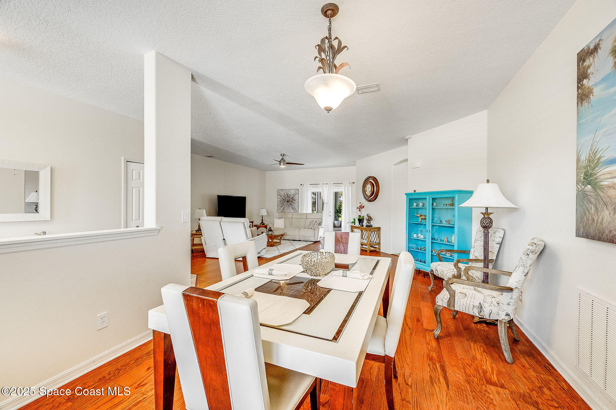1137 Morgan Circle Northeast Palm Bay, FL 32905 - Photo 12 of 64 a view of a dining room with furniture window and wooden floor