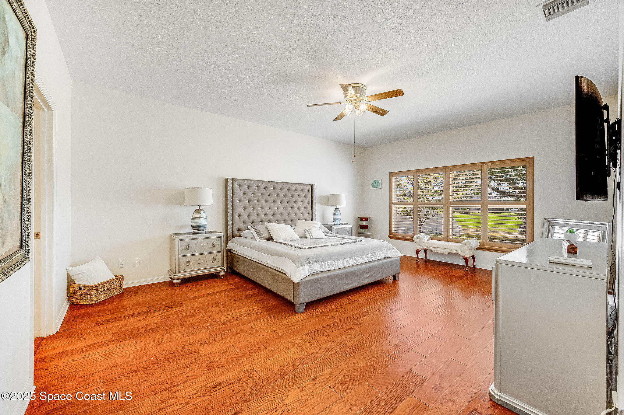 1137 Morgan Circle Northeast Palm Bay, FL 32905 - Photo 17 of 64 a living room with furniture and a flat screen tv