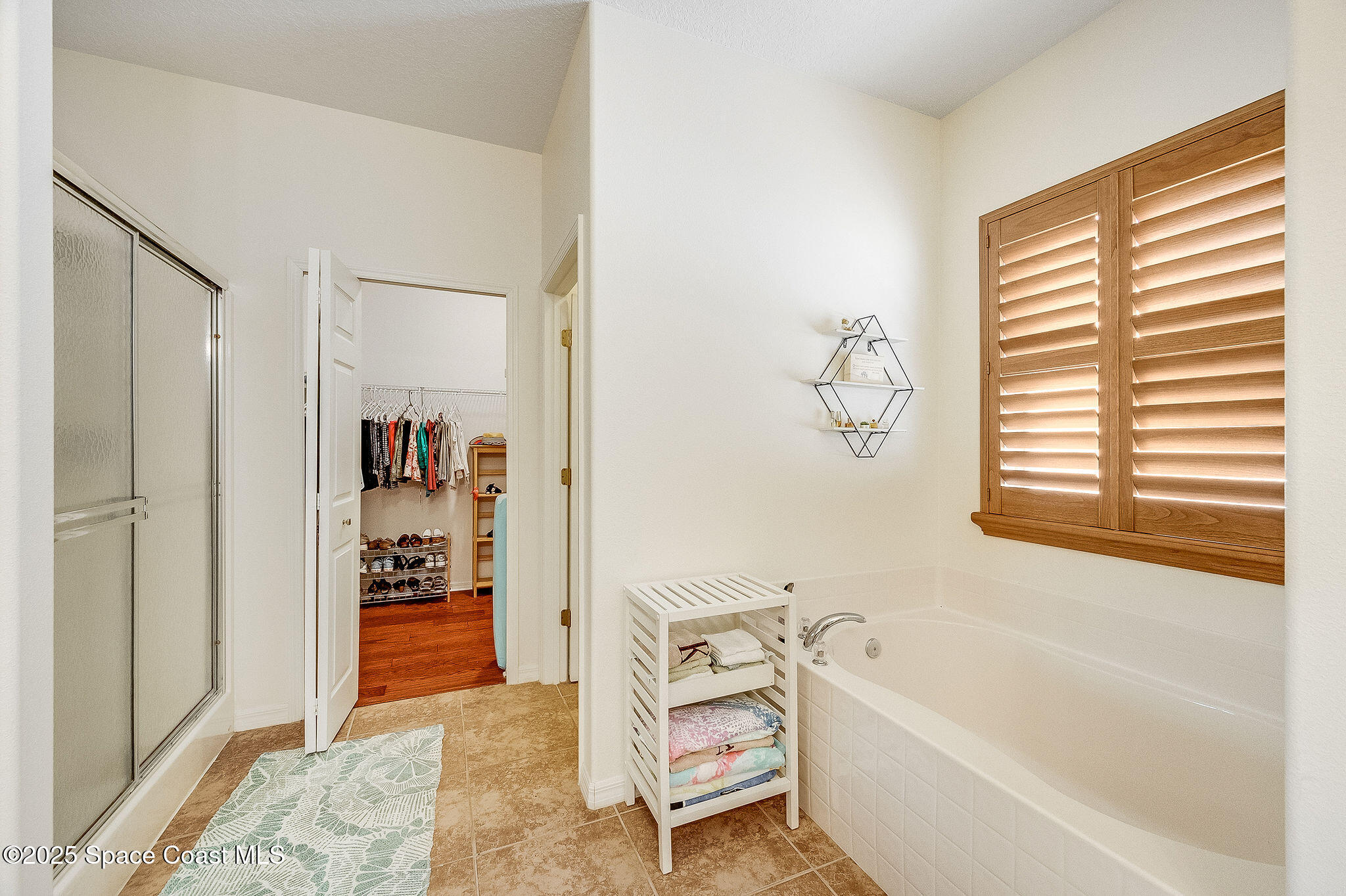 1137 Morgan Circle Northeast Palm Bay, FL 32905 - Photo 23 of 64 a bathroom with a bathtub and a shower